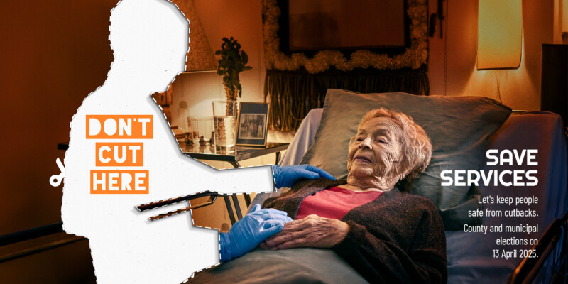 An elderly person lies on a bed. A human-shaped figure that looks like a cut out paper doll stands beside the bed. Words “Don’t cut here” are printed on the figure. Text in the lower right corner reads: “Save services. Let’s keep people safe from cutbacks. County and municipal elections on 13 April 2025.”